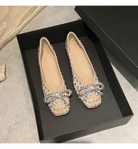 Elegant beige ballet flats with crystal bow and all-over rhinestones in a black gift box.