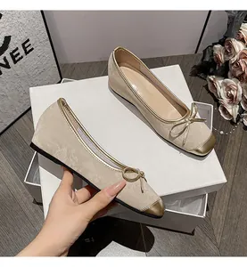 French retro beige suede ballet flats with gold metallic toe cap and bow detailing