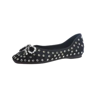 Elegant black ballet flats adorned with shimmering rhinestones and a delicate bow detail