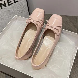 French vintage pink patent leather ballet flats with bow detail presented in gift box