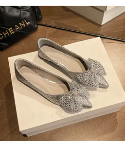 Silver sequined flat shoes with crystal-embellished bows and pointed toes for wedding