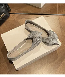 Silver sequin wedding flats with rhinestone bow and pointed toe for banquets