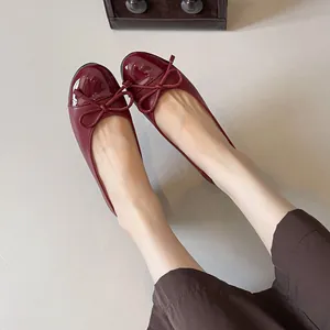 French style burgundy ballet flats featuring round toe and delicate bow ornament detail