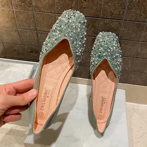 Elegant square-toed flat shoes for women featuring green crystals and white pearls