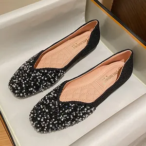 Elegant black square-toe flat shoes for women featuring faux pearl and rhinestone toe details