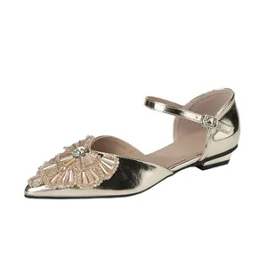Elegant gold rhinestone low-heel sandals with pointed toe and adjustable ankle strap
