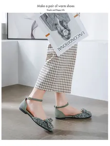 Elegant close-up view of glitter rhinestone flat shoes with bow and ankle strap details