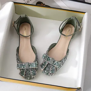 Elegant green square toe flat shoes featuring sparkly rhinestones and a large decorative bow