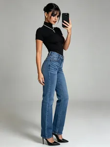 Full-body shot of high-waisted washed straight-leg denim jeans on a model