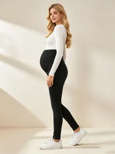 Full side view of stylish black maternity skinny jeans with soft over-belly support band