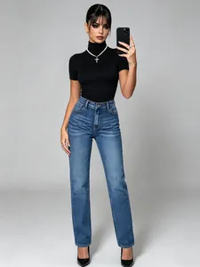 Full length view of high-waisted blue straight-leg denim jeans styled on a model