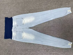Full view of light blue maternity skinny jeans with navy elastic belly support