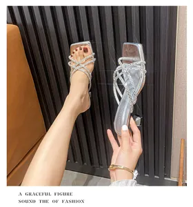 Detailed view of silver rhinestone-encrusted straps on elegant high-heeled sandals