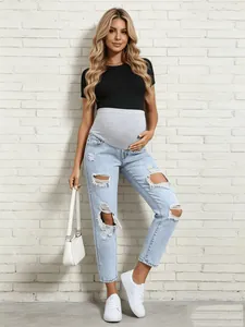 Western style light blue ripped maternity jeans featuring high waist belly support