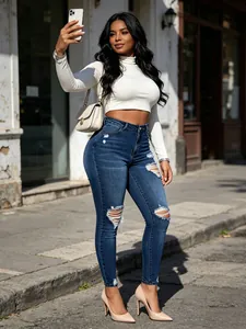 Vue style rue de jean skinny taille haute bleu foncé avec déchirures aux genoux