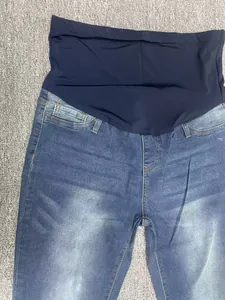 Detailed macro view of comfortable elastic maternity jeans belly band