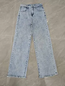 Full view of light wash wide-leg jeans featuring delicate rhinestone embellishments.