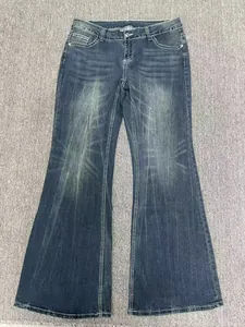 Jeans svasati vintage blu scuro a vita bassa con lavaggio sbiadito e cuciture a contrasto