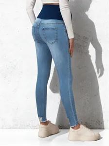 Back view of high-waist maternity skinny jeans featuring an elastic belly support band.