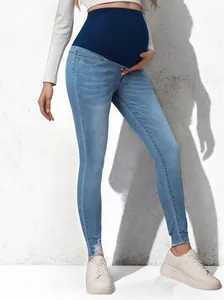 Stylish high-stretch maternity skinny jeans with support belly band in light blue wash
