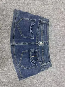 Vintage distressed blue denim shorts with a tight fit and functional back pockets.