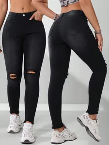 Zwarte skinny jeans voor dames met gescheurde knieën en gerafelde zomen, dubbel zicht.