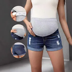 Vue détaillée d'un short en jean de maternité vieilli avec bandeau de soutien gris