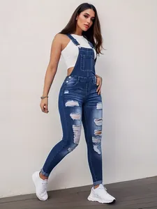 Full-body view of slim-fit distressed blue denim overalls for women with ripped details