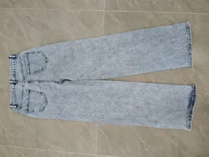 High-waisted wide-leg denim jeans in light blue wash featuring a relaxed fit for women