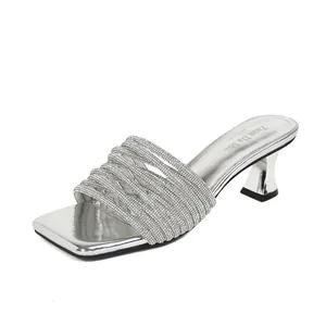 Silver French style high heel mules with rhinestone straps and square toe design