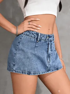 Detailed view of women's vintage distressed blue denim mini skirt with safety lining