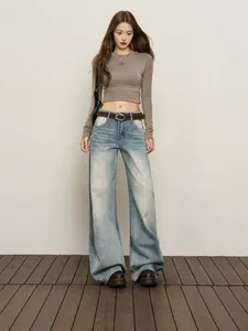 High-waisted wide-leg denim jeans in light blue wash for a trendy casual style.