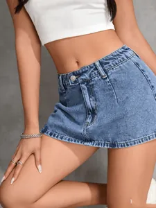 Close-up view of vintage blue wash denim mini skirt with built-in safety shorts.