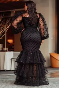 Elegant black polka-dot mermaid dress with tiered ruffled skirt and sheer puff sleeves