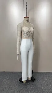 Elegant sleeveless jumpsuit featuring an embroidered sequin bodice and white long pants.