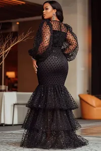 Elegant black polka dot mermaid dress with sheer puff sleeves and tiered tiered hem