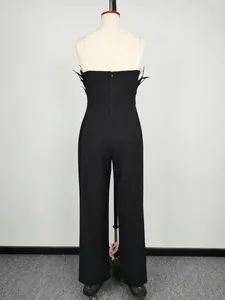 Close-up back view of a chic black strapless jumpsuit featuring elegant feather accents