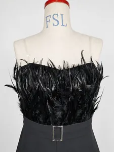 Detail view of stylish black feather strapless jumpsuit with metal belt buckle