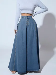 Detailed view of high-waisted denim A-line maxi skirt with button-front design.