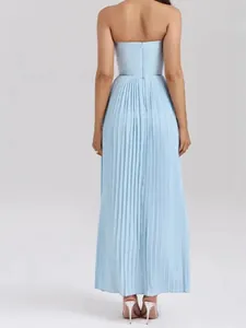 Rear view of light blue strapless pleated maxi dress showing detail of fine pleats