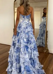 Elegant strapless floral print evening gown featuring a tiered ruffled skirt detail