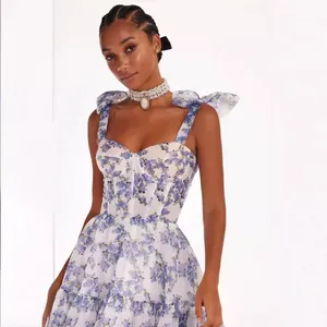 Elegant white organza evening gown with romantic purple floral prints and corset
