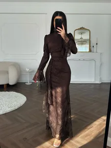 Elegant floor-length brown floral lace evening gown featuring long flare sleeves and belt.