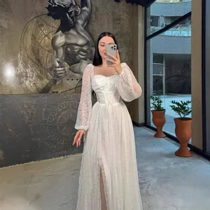 Detailed close-up of elegant white lace long sleeve maxi dress with corset waist.