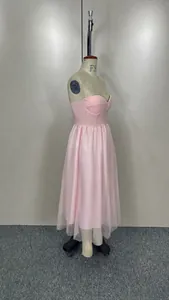 Side view of a pink sweetheart neckline tulle mesh midi dress on a mannequin