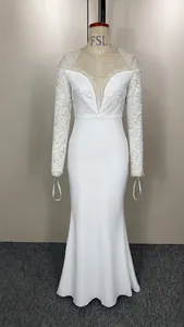 Full view of white off-shoulder lace long sleeve floor-length wedding dress on a mannequin