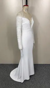 Elegant off-the-shoulder lace wedding dress with long sleeves and floor-length mermaid tail