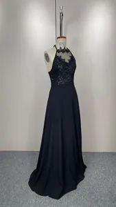 Elegant black halter lace sequin chiffon evening gown displayed on a mannequin.