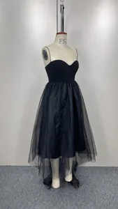 Elegant black spaghetti strap mesh dress displayed on a mannequin
