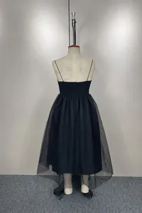 Back view of an elegant black spaghetti strap dress with a layered tulle mesh skirt